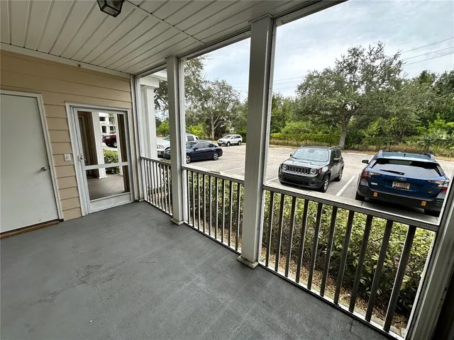 a view of a balcony with wooden floor