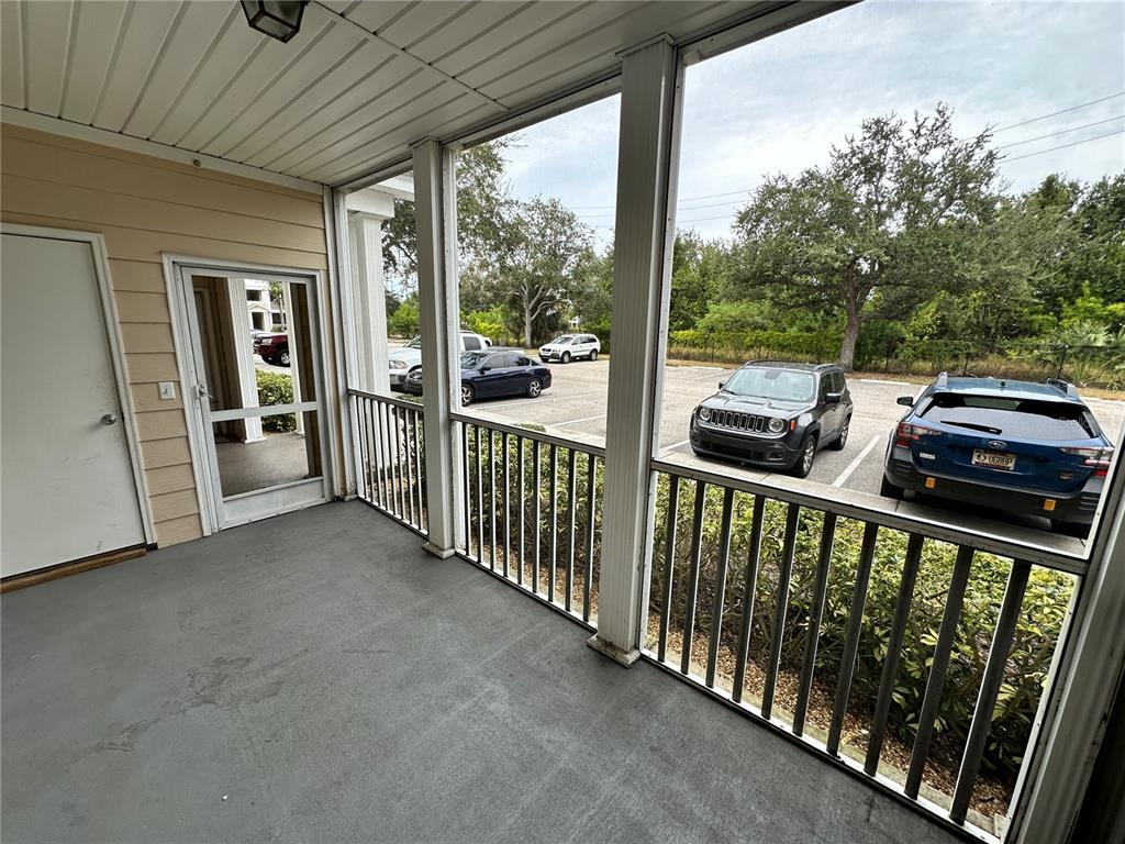4802 51st Street West, Unit 413 Bradenton, FL 34210 - Photo 3 of 40 a view of a balcony with wooden floor