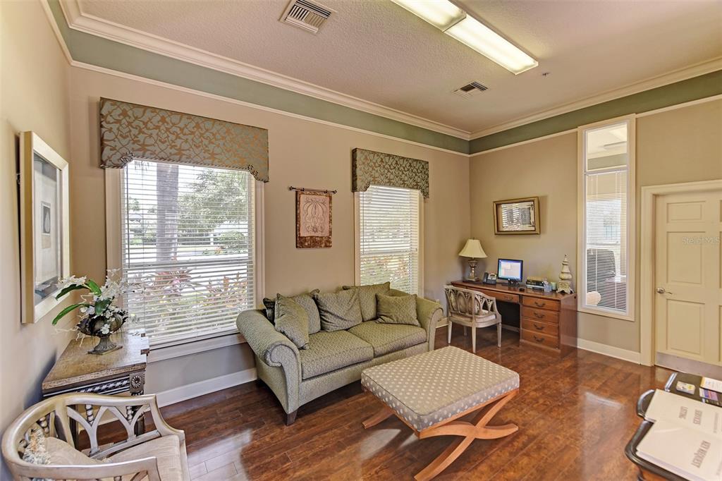 4802 51st Street West, Unit 413 Bradenton, FL 34210 - Photo 33 of 40 a living room with furniture and a large window