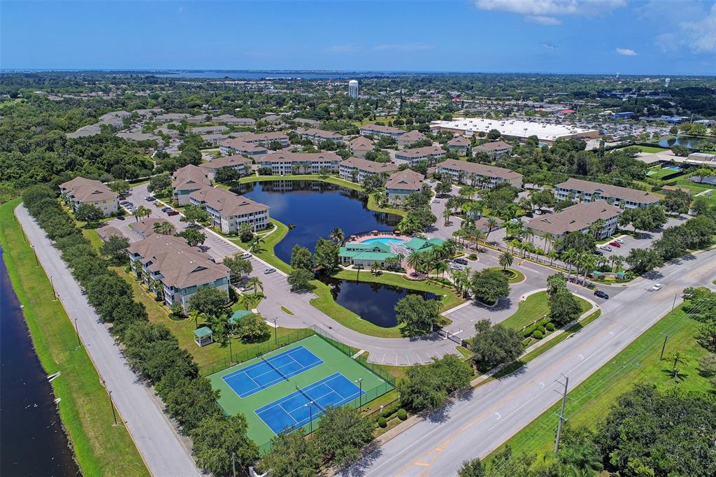 4802 51st Street West, Unit 413 Bradenton, FL 34210 - Photo 36 of 40 an aerial view of residential houses with outdoor space