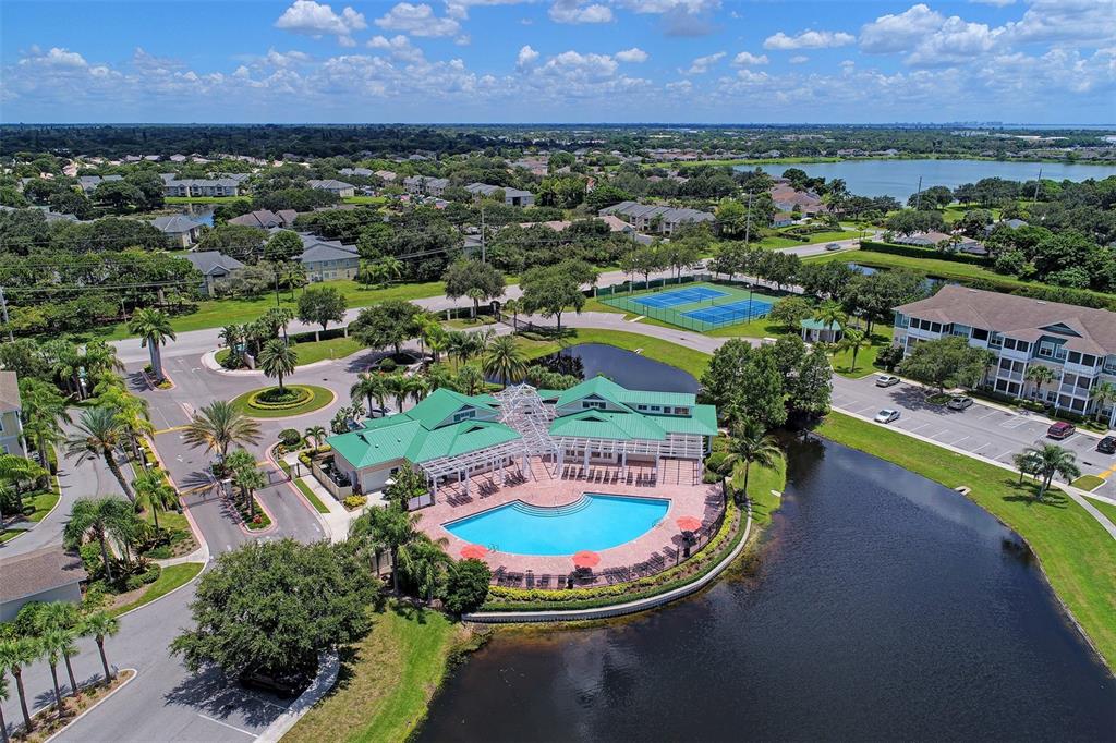 4802 51st Street West, Unit 413 Bradenton, FL 34210 - Photo 39 of 40 an aerial view of a house with a swimming pool outdoor seating and yard