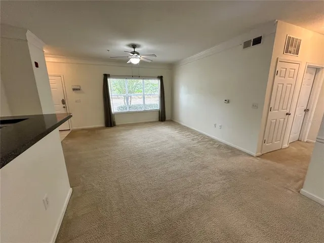 an empty room with windows and entrance