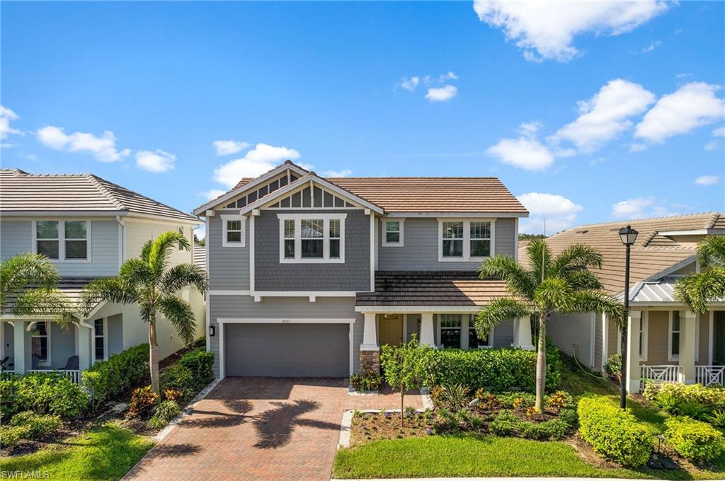 a aerial view of a house with a yard