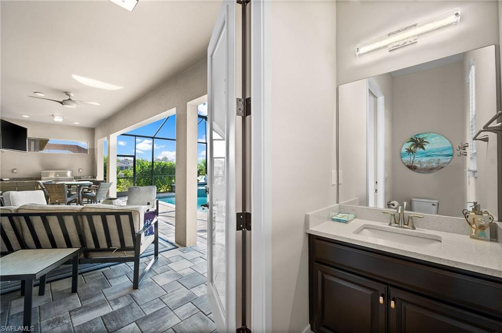 3521 Pilot Circle Naples, FL 34120 - Photo 16 of 36 a view of a bathroom from a hallway
