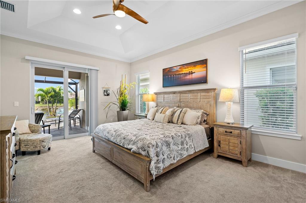 3521 Pilot Circle Naples, FL 34120 - Photo 23 of 36 a bedroom with a bed a table and chairs