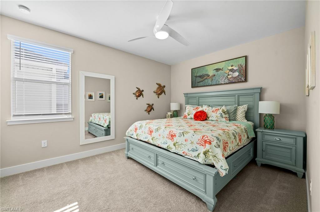 3521 Pilot Circle Naples, FL 34120 - Photo 26 of 36 a bed sitting in a bedroom next to a window