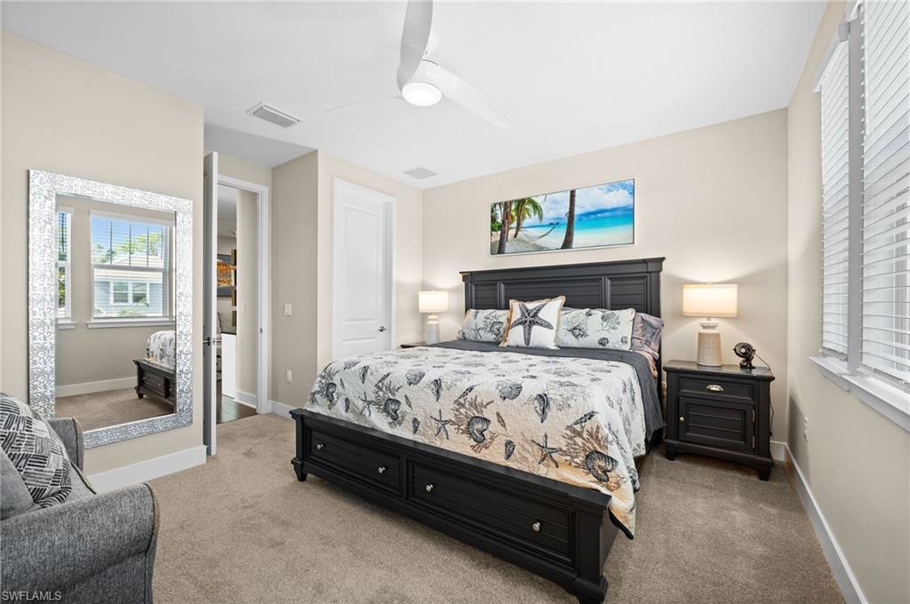 3521 Pilot Circle Naples, FL 34120 - Photo 28 of 36 a bed sitting in a bedroom next to a window