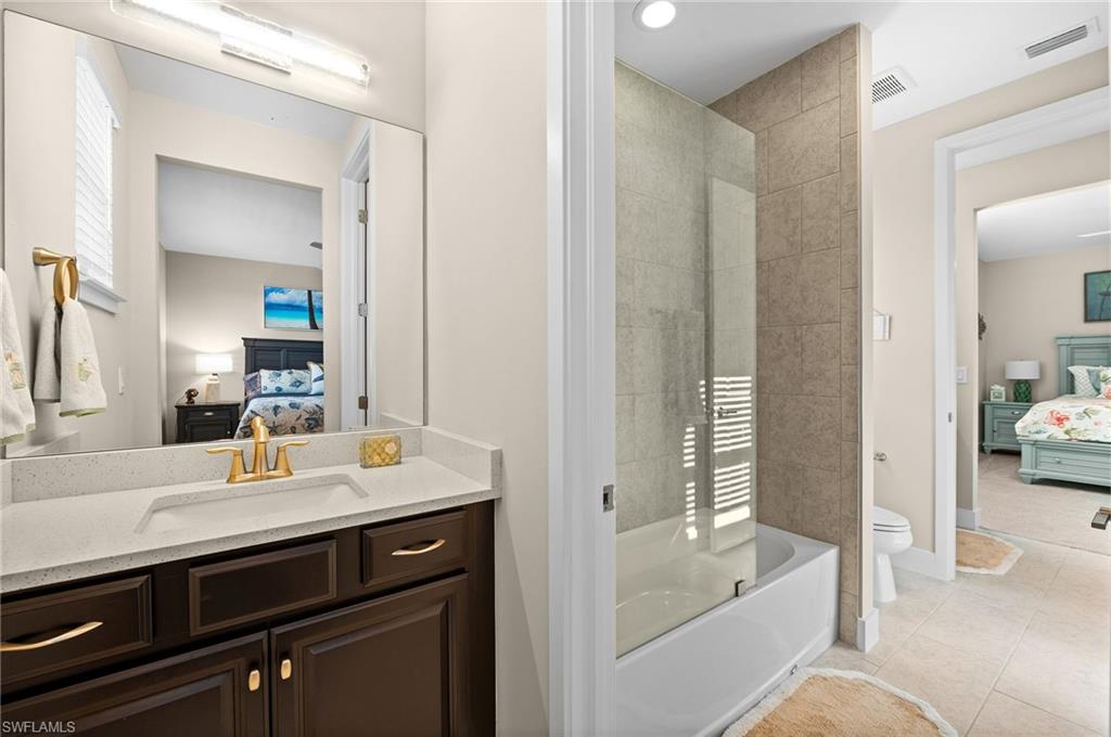 3521 Pilot Circle Naples, FL 34120 - Photo 29 of 36 a en suite bathroom with a sink double vanity