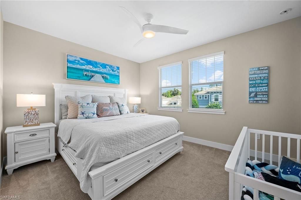 3521 Pilot Circle Naples, FL 34120 - Photo 31 of 36 a spacious bedroom with a bed and a window