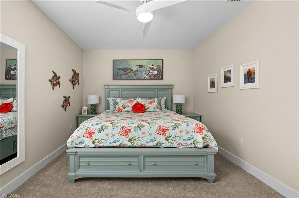 3521 Pilot Circle Naples, FL 34120 - Photo 33 of 36 a bedroom with a bed and a painting on the wall