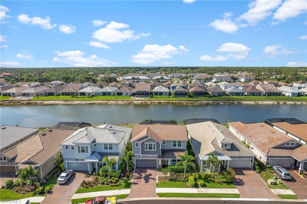 3521 Pilot Circle Naples, FL 34120 - Photo 34 of 36 an aerial view of a house with a lake view and mountain view