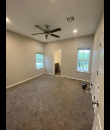a view of entryway and hall with a window
