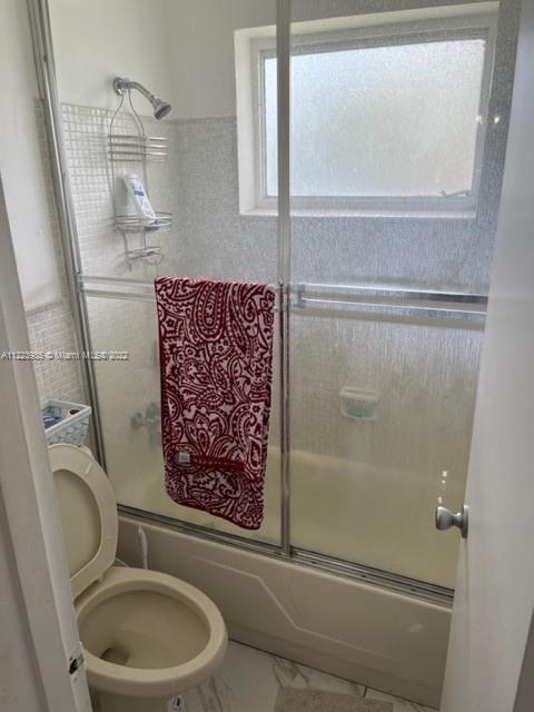 7505 Southwest 82nd Street, Unit 322 Miami, FL 33143 - Photo 8 of 10 a bathroom with a toilet and a shower