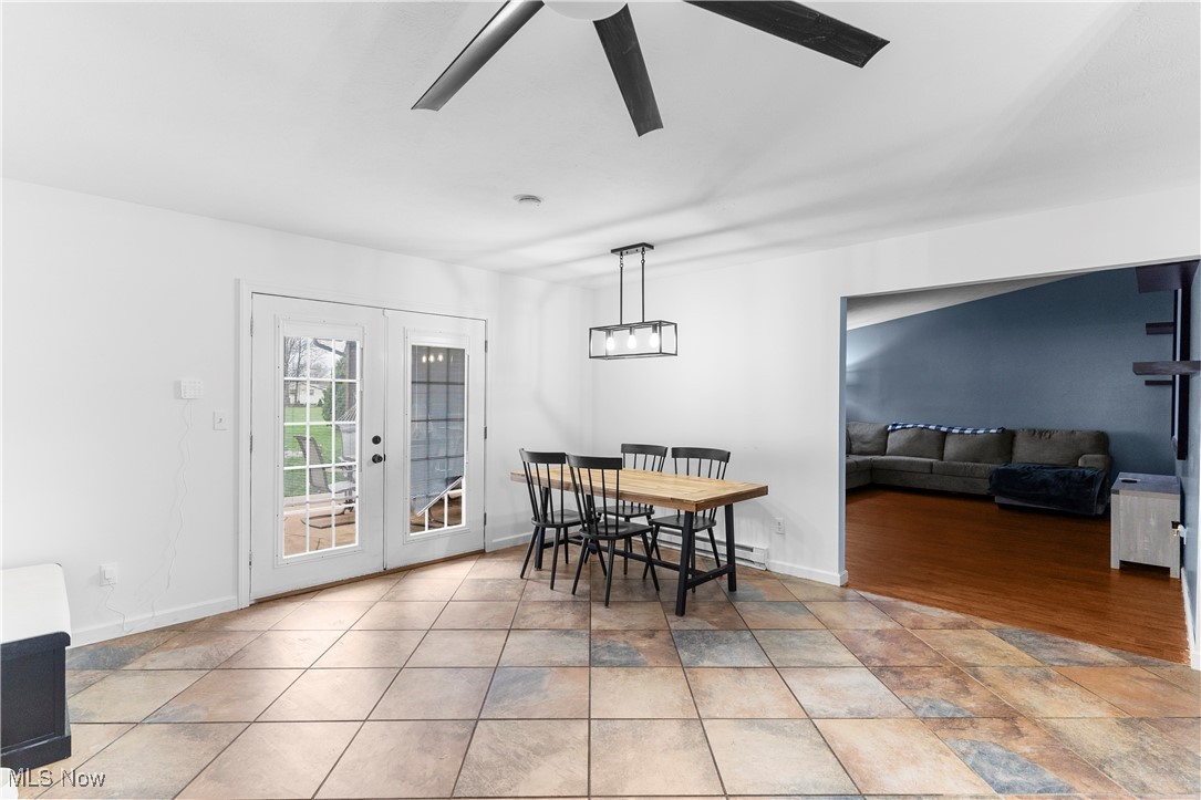 4075 Kirk Road Austintown, OH 44511 - Photo 11 of 40 Dining room featuring french doors, ceiling fan, and baseboards