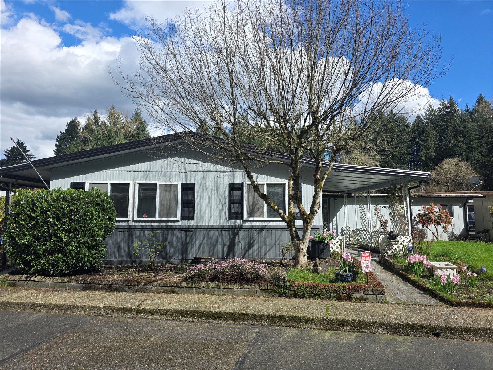 a front view of a house with garden