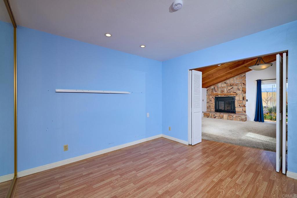 400 San Dimas Avenue Oceanside, CA 92057 - Photo 17 of 28 a view of a livingroom with wooden floor and a ceiling fan