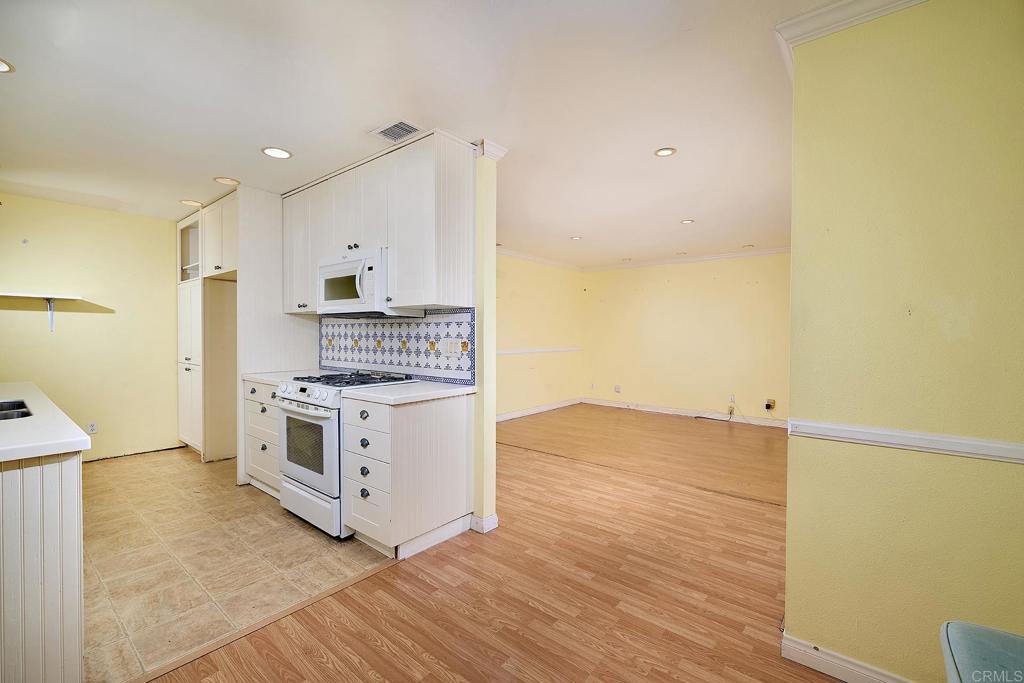 400 San Dimas Avenue Oceanside, CA 92057 - Photo 7 of 28 a view of kitchen with stove top oven and cabinets
