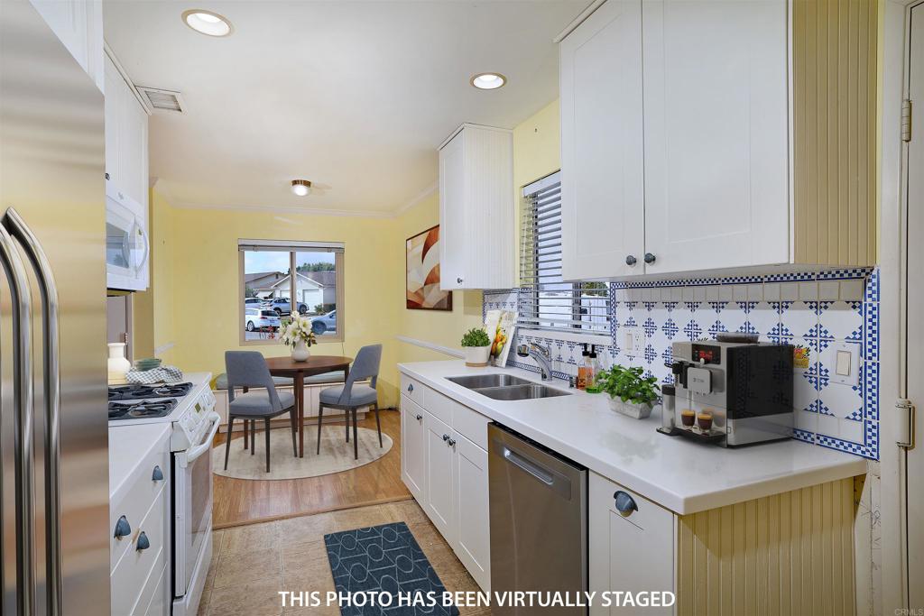 400 San Dimas Avenue Oceanside, CA 92057 - Photo 10 of 28 a kitchen with a cabinets and appliances