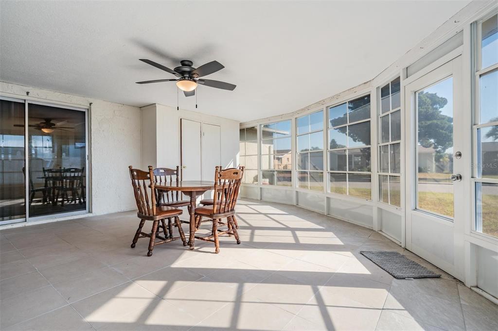 3608 Umber Road Holiday, FL 34691 - Photo 17 of 20 a dining room with furniture and a floor to ceiling window
