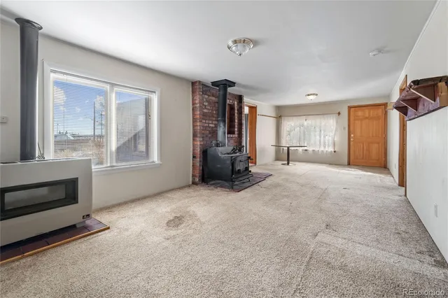 a kitchen with stainless steel appliances a stove a sink and a refrigerator