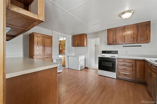 a kitchen with cabinets a sink and appliances