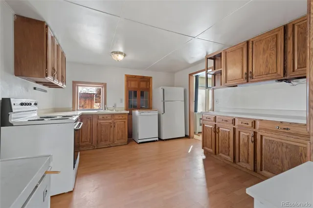 a view of an empty room with windows