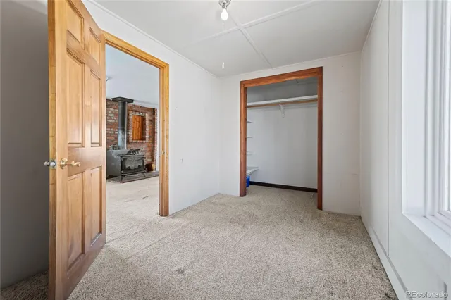 a white toilet sitting next to a bath tub and a shower
