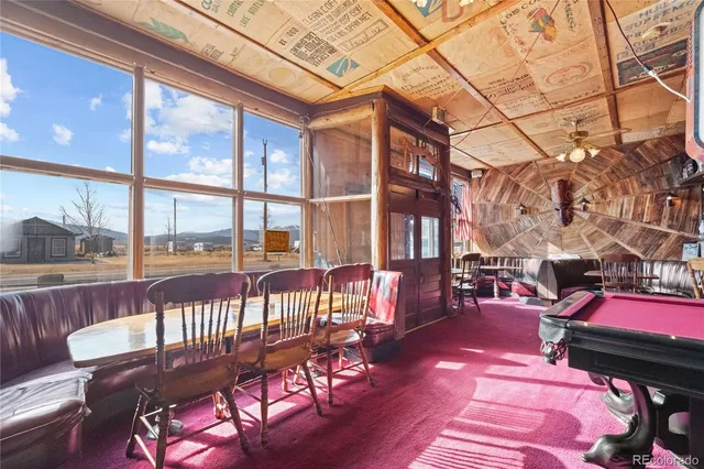 a view of a chairs and tables in a patio