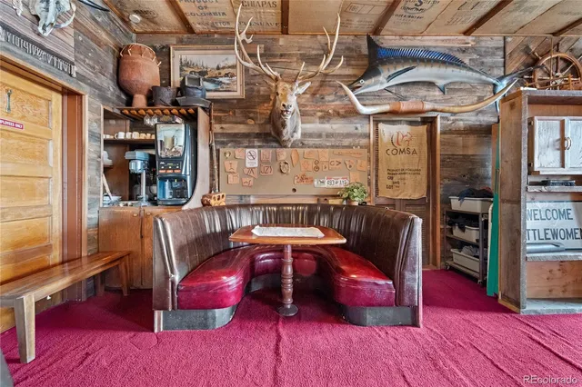 a view of a living room with furniture and a rug