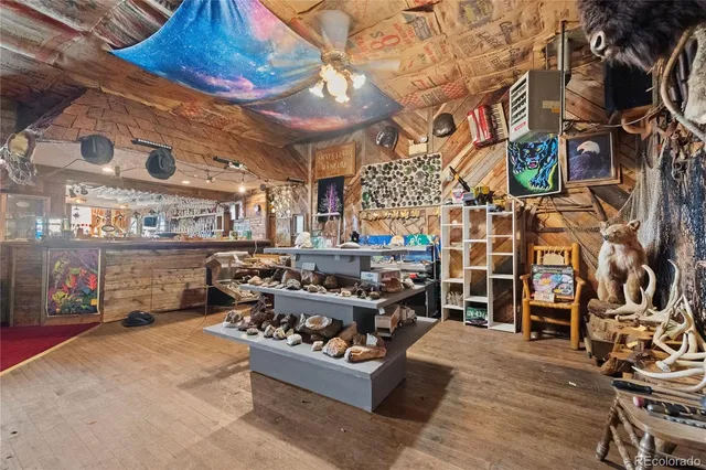 a bedroom with two beds and painting on the wall