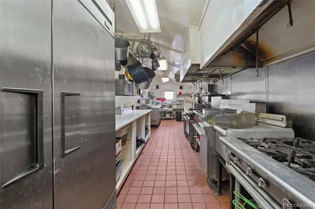 a bedroom with double bed and a window