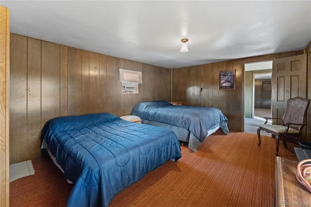 a bathroom with a sink a toilet a mirror and shower