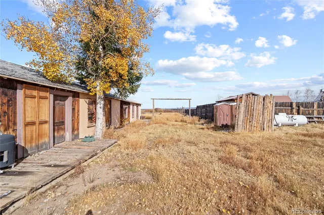 a view of a house with snow on the background