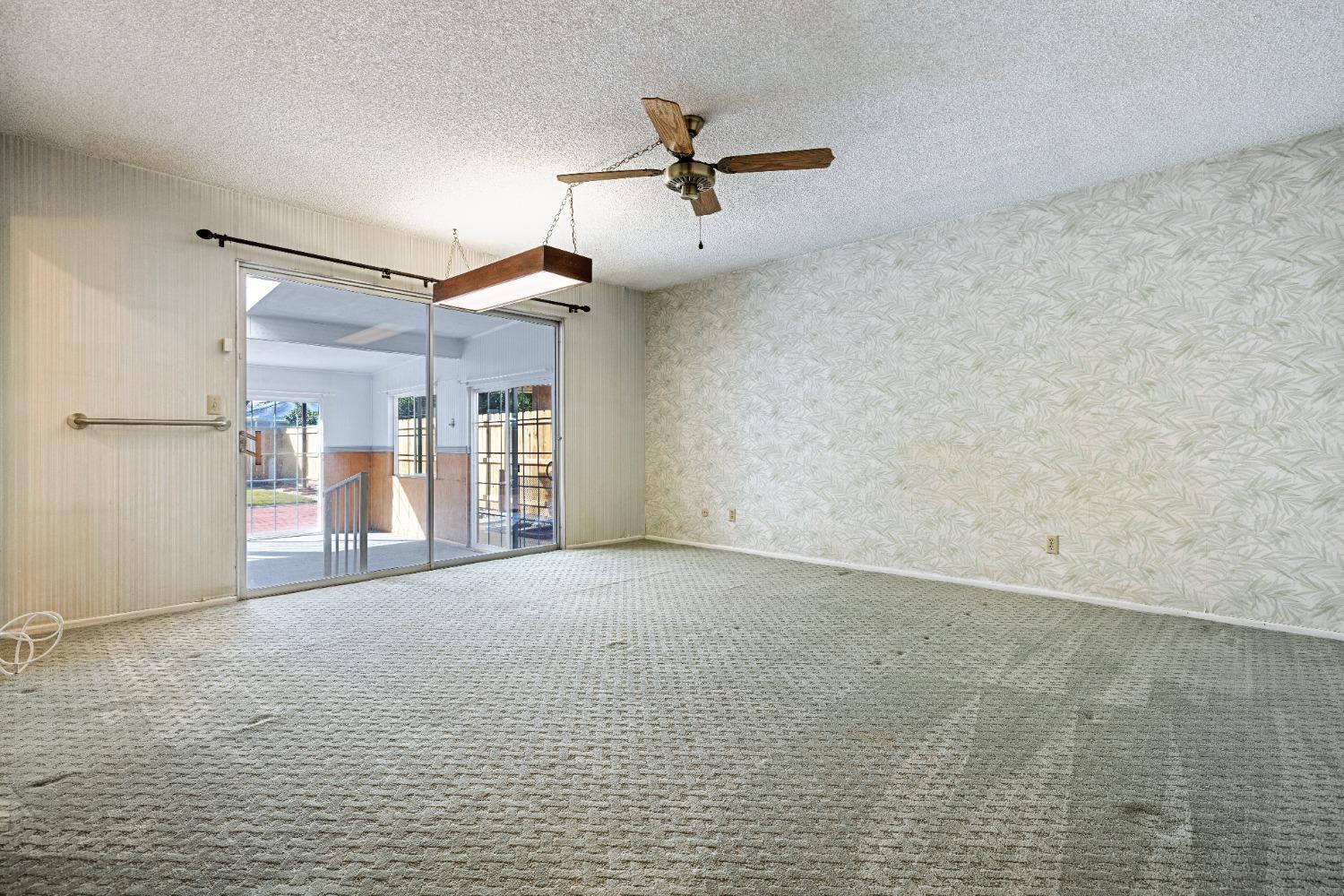 100 Hilton Street Madera, CA 93637 - Photo 12 of 30 a view of a livingroom with a ceiling fan