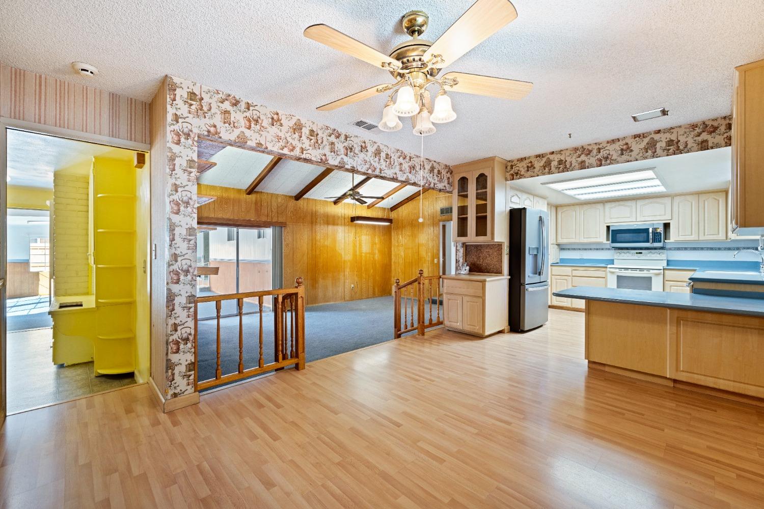 100 Hilton Street Madera, CA 93637 - Photo 17 of 30 a view of a livingroom with furniture a ceiling fan and wooden floor