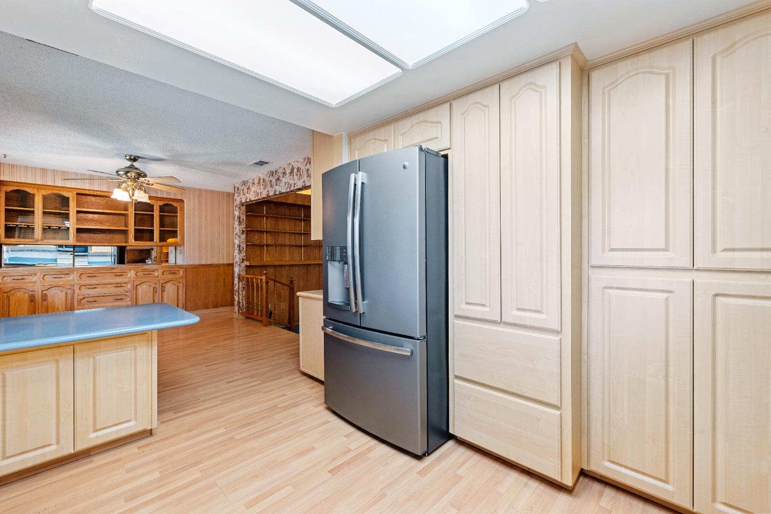100 Hilton Street Madera, CA 93637 - Photo 19 of 30 a kitchen with stainless steel appliances granite countertop a refrigerator and a sink