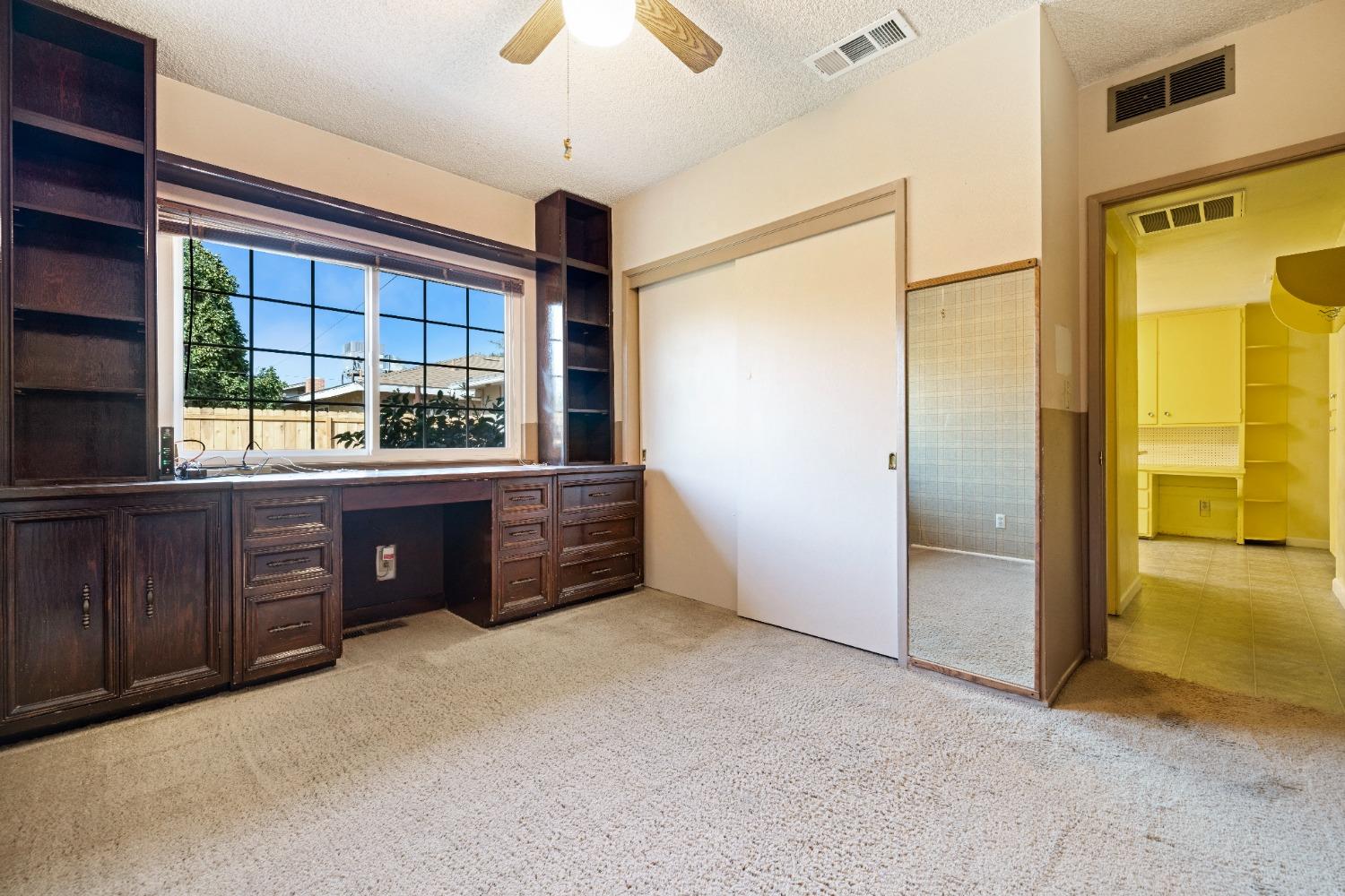 100 Hilton Street Madera, CA 93637 - Photo 24 of 30 an empty room with window and cabinet