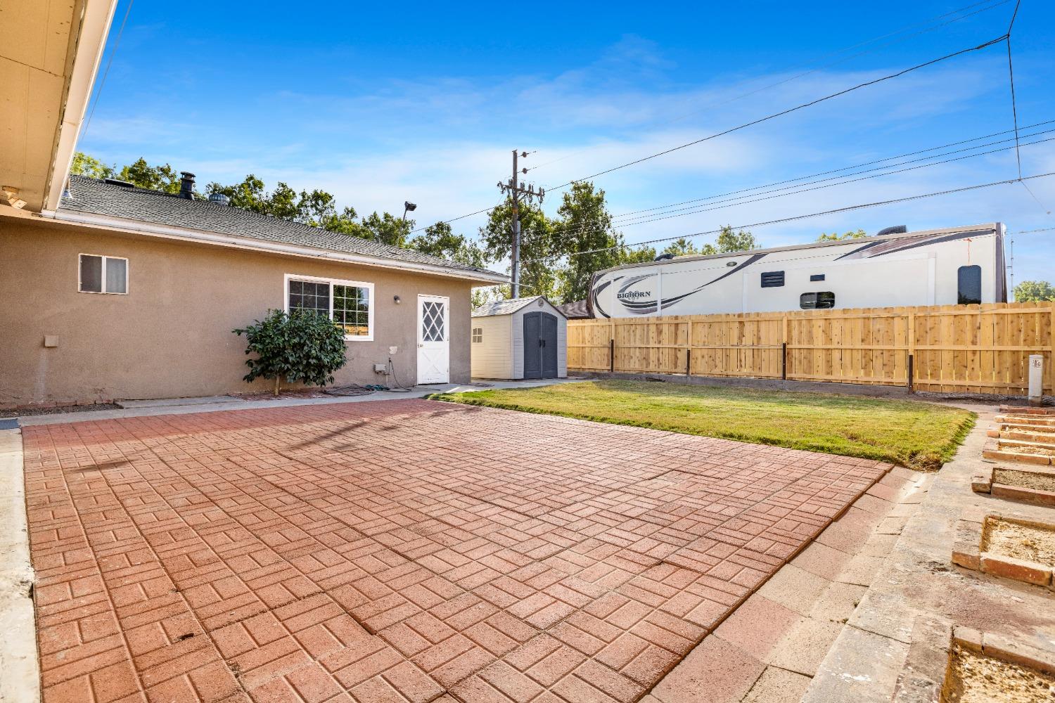 100 Hilton Street Madera, CA 93637 - Photo 29 of 30 a view of a house with a yard