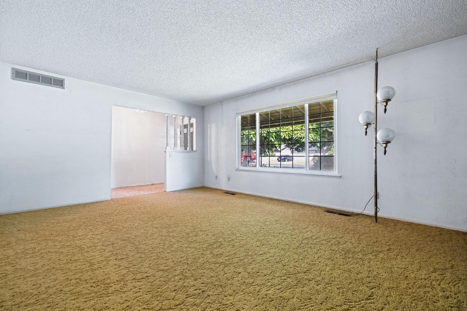 100 Hilton Street Madera, CA 93637 - Photo 8 of 30 a view of an empty room with windows
