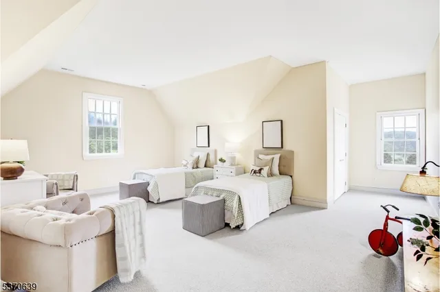 a bedroom with bed and window