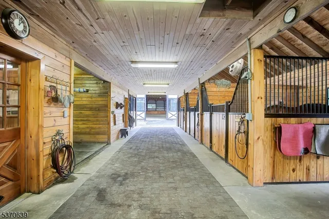 a view of a hallway with wooden floors