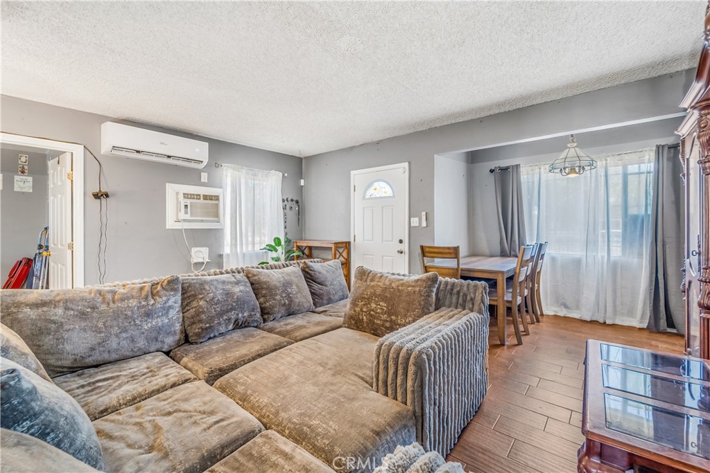 1709 Rialto Avenue Colton, CA 92324 - Photo 8 of 26 a living room with furniture and a window