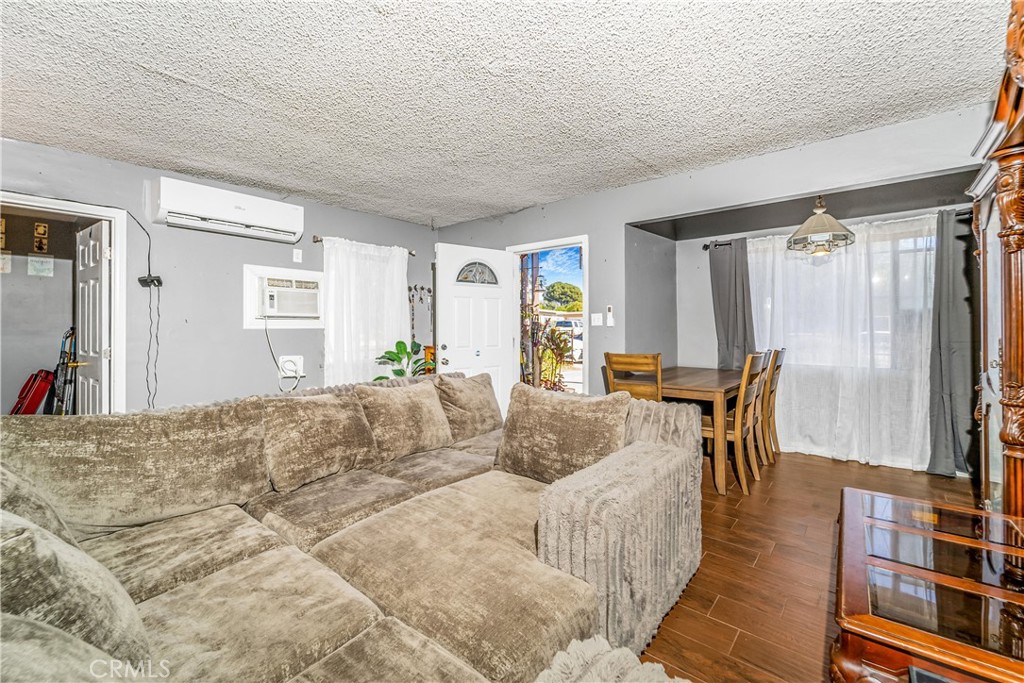 1709 Rialto Avenue Colton, CA 92324 - Photo 10 of 26 a bed room with a bed and a chair