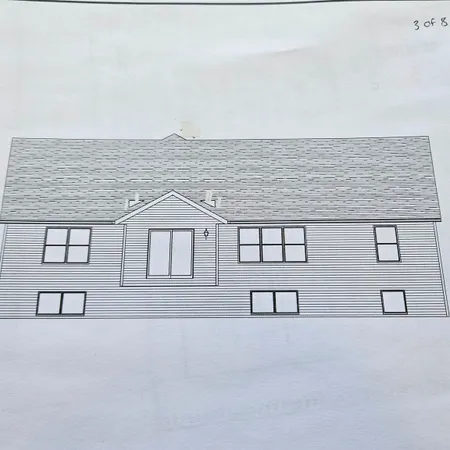 a front view of a building with garage