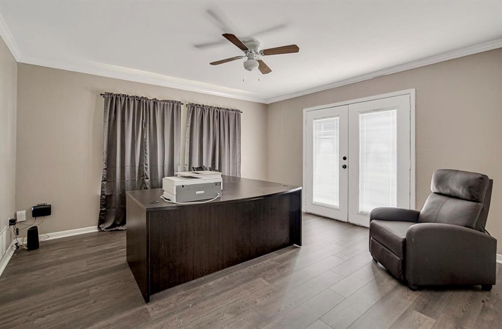3952 J J Rendon Road Burleson, TX 76028 - Photo 11 of 25 The spacious primary bedroom is being used as an office at this time. Light and bright with double doors leading out onto an open patio.