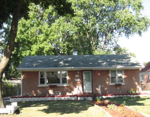 a front view of a house with yard