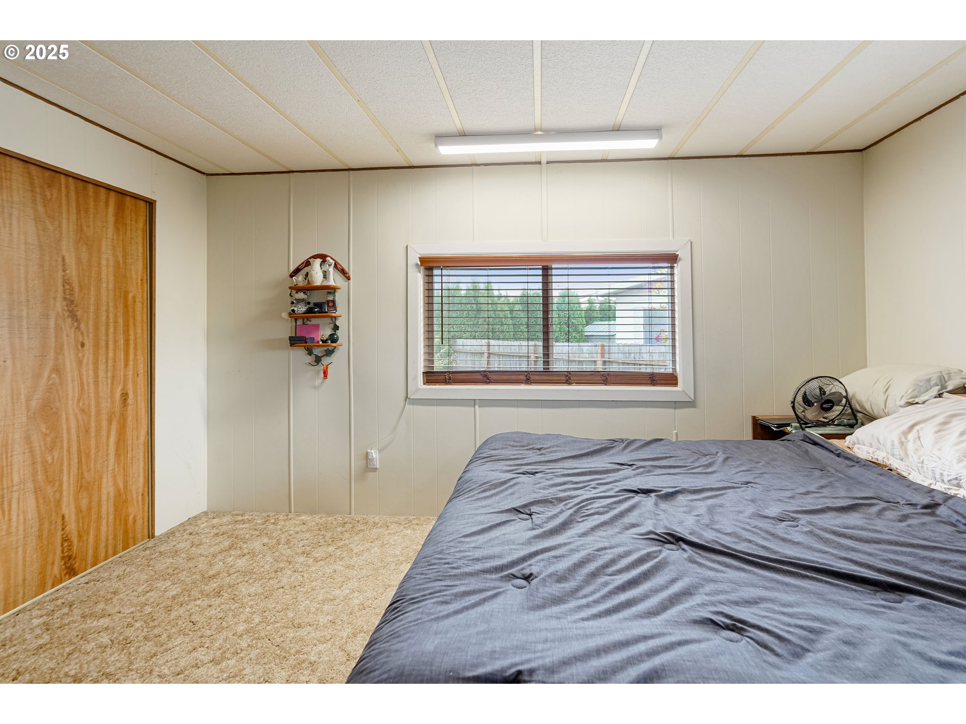 5422 Portland Road Northeast, Unit 56 Salem, OR 97305 - Photo 24 of 38 a bedroom with a bed and a window