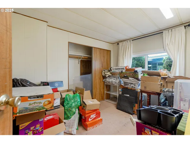 a living room filled with furniture hardwood floor and a window