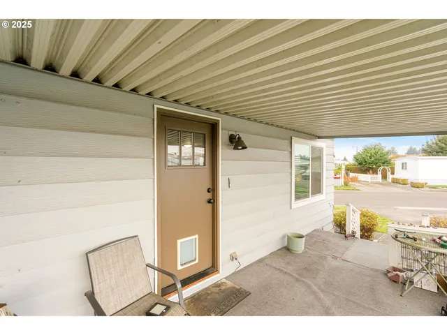 a view of a patio with wooden floor