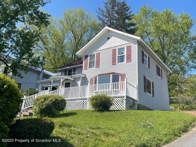 220 Main Street Laceyville, PA 18623 - Photo 1 of 39 a front view of a house with a yard